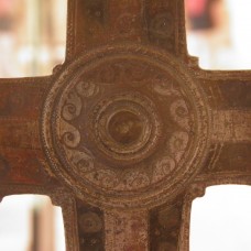 Sun emblem at the heart of a processional cross